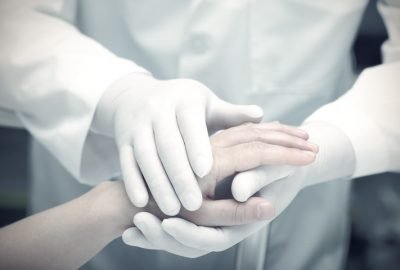 Hands of the doctor and patient